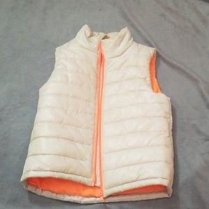 White and orange vest